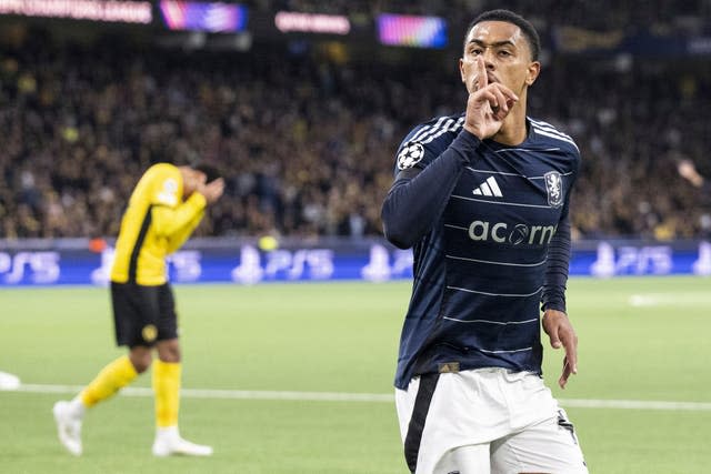 Jacob Ramsey puts his finger to his mouth to silence the Young Boys fans after scoring for Aston Villa