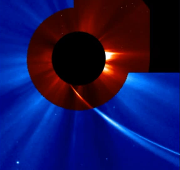 This image shows Comet ISON extremely close to the sun as seen by the SOHO spacecraft on Nov. 28, 2013 during the comet's Thanksgiving Day close solar encounter. The comet's long tail is seen sweeping back away from the sun.