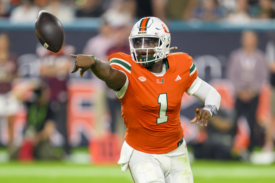 MIAMI GARDENS, FL – SEPTEMBER 27: Miami quarterback Cam Ward (1) makes a shovel pass during the college football game between the Virginia Tech Hokies and the University of Miami Hurricanes at Hard Rock Stadium on September 27, 2024 in Miami Gardens, FL. (Photo by Doug Murray/Icon Sportswire via Getty Images)