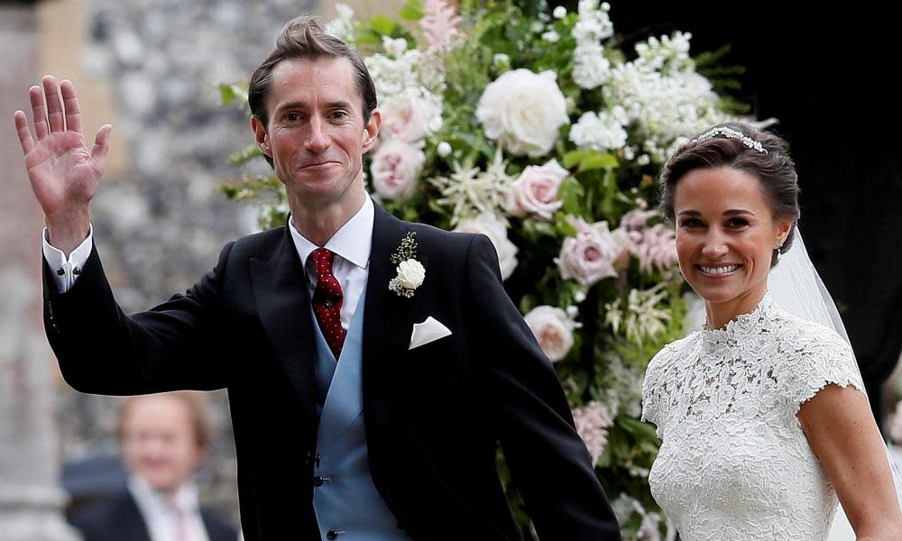 Pippa Middleton and her new husband James Matthews smile following their wedding.