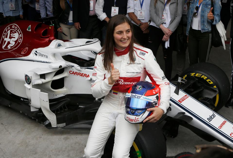 Colombian Formula One driver Tatiana Calderon poses as she becomes the first Latin American woman Formula One driver, at the Hermanos Rodriguez racetrack in Mexico City, Tuesday, Oct. 30, 2018. (AP Photo/Marco Ugarte)