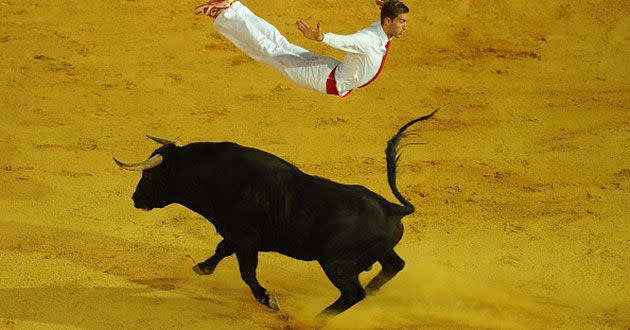 Fabien Napias leaps over a charging bull at the end of the Liga de Corte Puro finals at the Plaza de Toros. Source: Getty