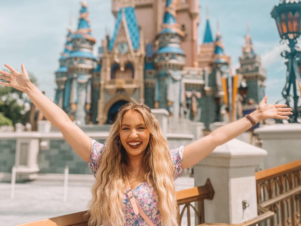 kayleigh price in front of cinderella castle at magic kingdom