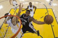 May 14, 2017; Oakland, CA, USA; San Antonio Spurs forward LaMarcus Aldridge (12) shoots the basketball against Golden State Warriors center JaVale McGee (1) during the first half in game one of the Western conference finals of the 2017 NBA Playoffs at Oracle Arena. The Warriors defeated the Spurs 113-111. Mandatory Credit: Kyle Terada-USA TODAY Sports