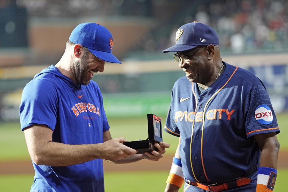 Houston Astros manager Dusty Baker Jr., right, presents New York Mets pitcher Justin Verlander his 2022 World Series Championship ring before a baseball game Monday, June 19, 2023, in Houston. (AP Photo/David J. Phillip)