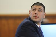 Former New England Patriots player, Aaron Hernandez, listens to testimony during his murder trial at Bristol County Superior Court, in Fall River, Massachusetts, February 24, 2015. Hernandez is accused of the murder of Odin Lloyd in June 2013. REUTERS/Brian Snyder (UNITED STATES - Tags: CRIME LAW SPORT FOOTBALL)