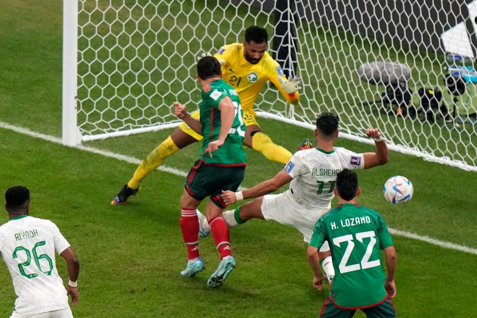 Mexico's Henry Martin scores the opening goal during the World Cup group C football match between Saudi Arabia and Mexico, at the Lusail Stadium in Lusail, Qatar, Wednesday, Nov. 30, 2022. (AP Photo/Luca Bruno)