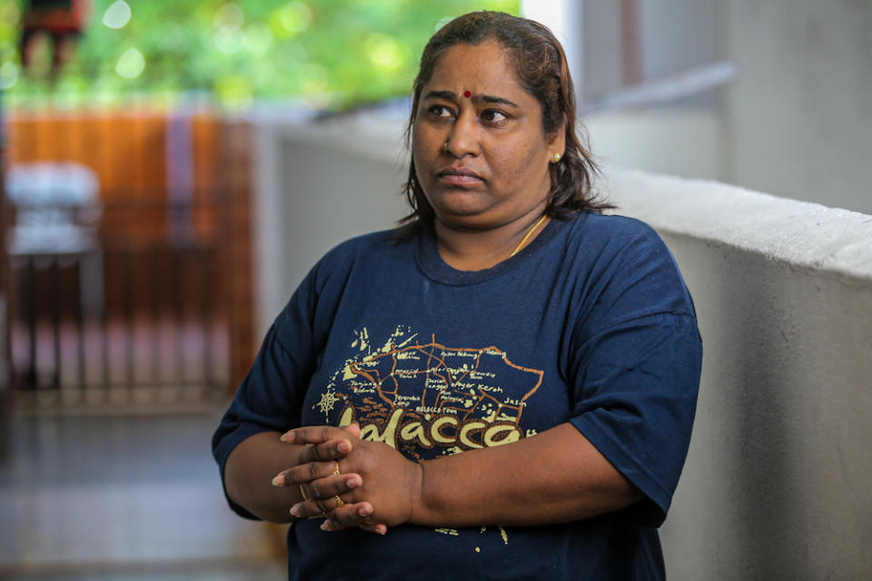 Amartham Ganesan helps out Noryani when they are struggling for money. Here she’s standing outside Noryani’s house. — Picture by Hari Anggara