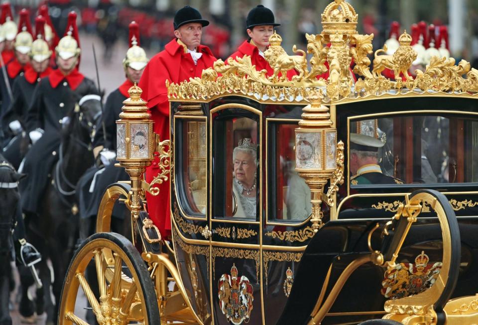 The Queen, accompanied by the Prince of Wales and Duchess of Cornwall, returns to Buckingham Palace in the Diamond Jubilee State Coach (PA)
