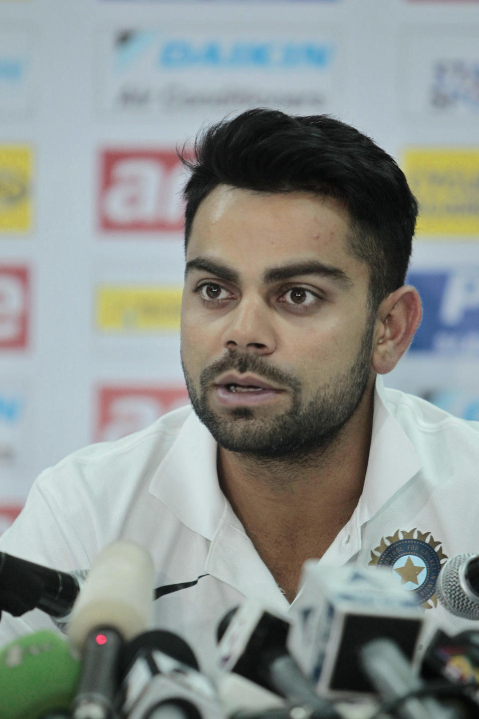 India cricket team captain Virat Kohli addresses a press conference ahead of the Asia Cup tournament in Dhaka, Bangladesh, Sunday, Feb. 23, 2014. Pakistan plays Sri Lanka in the opening match of the five nation one day cricket event that begins Tuesday. (AP Photo/A.M. Ahad)