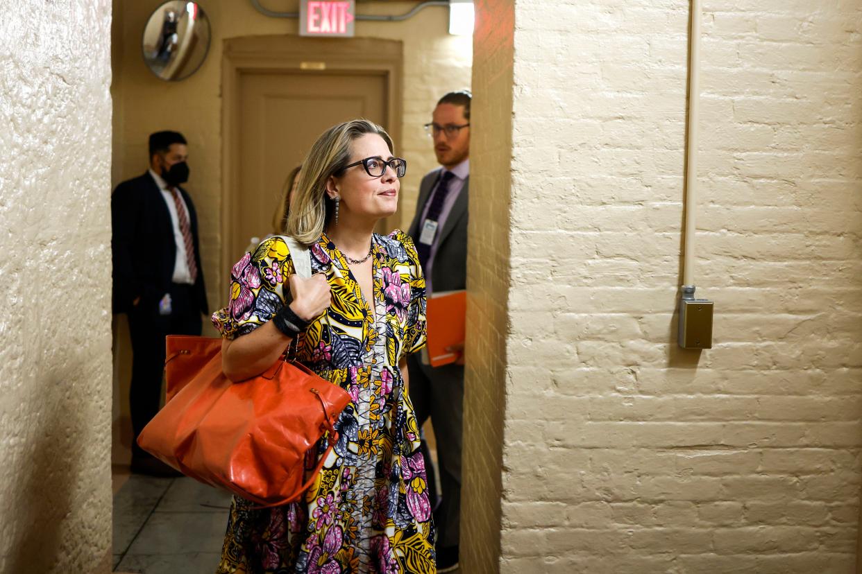 Sen. Kyrsten Sinema (D-Ariz.) leaves her office to walk to the Senate Chambers in the U.S. Capitol Building on Aug. 2, 2022 in Washington.