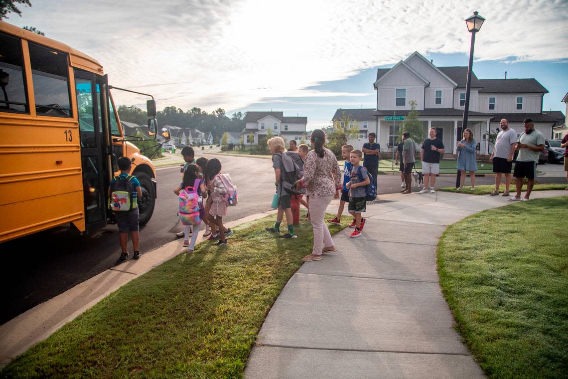 Apex Friendship Elementary School students board a bus Monday morning, Aug. 29, 2022 during the first day of the school’s 2022-2023 school year.