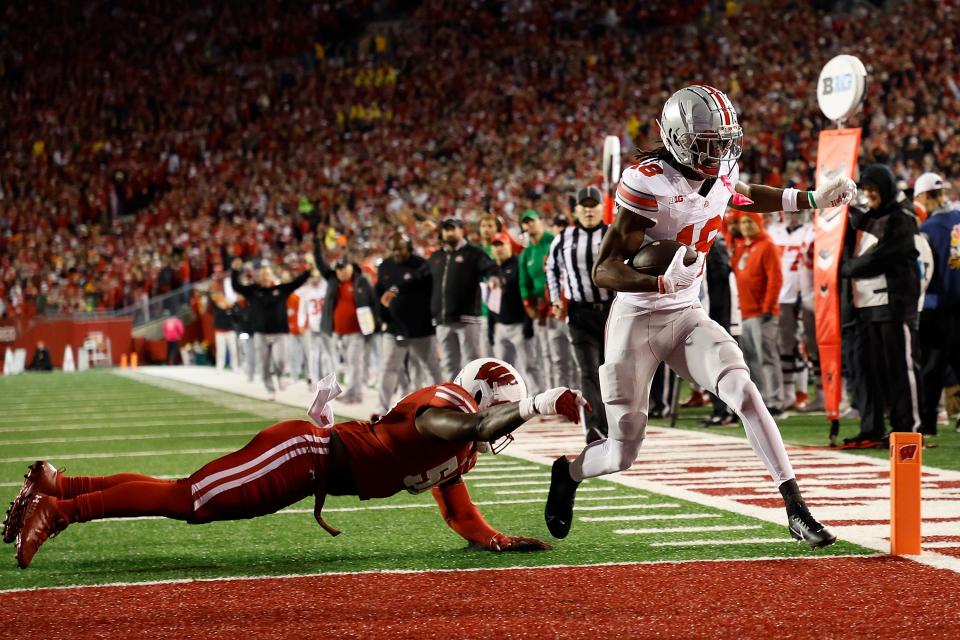 Marvin Harrison Jr. #18 of the Ohio State Buckeyes scores on a 16-yard touchdown pass during the second quarter against the Wisconsin Badgers at Camp Randall Stadium on Oct. 28, 2023, in Madison, Wisconsin.