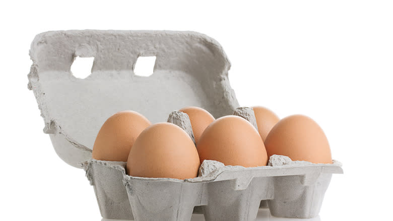 Cardboard egg carton with eggs