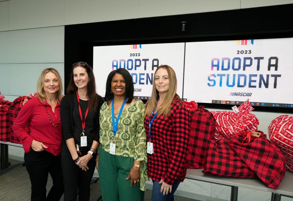 Volusia County Schools student advocates, from left, Rebecca Pitchford, Jennifer Watley, Delecia Stevenson and Lauren Hogan, prepare to distribute gifts for the Adopt a Student program, Dec. 13, 2023.