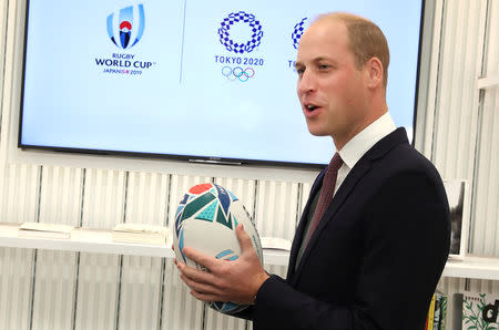 Britain's Prince William holds an official rugby ball for the Rugby World Cup 2019 at the official opening of Japan House in London, Britain, September 13, 2018. Tim P. Whitby/Pool via REUTERS