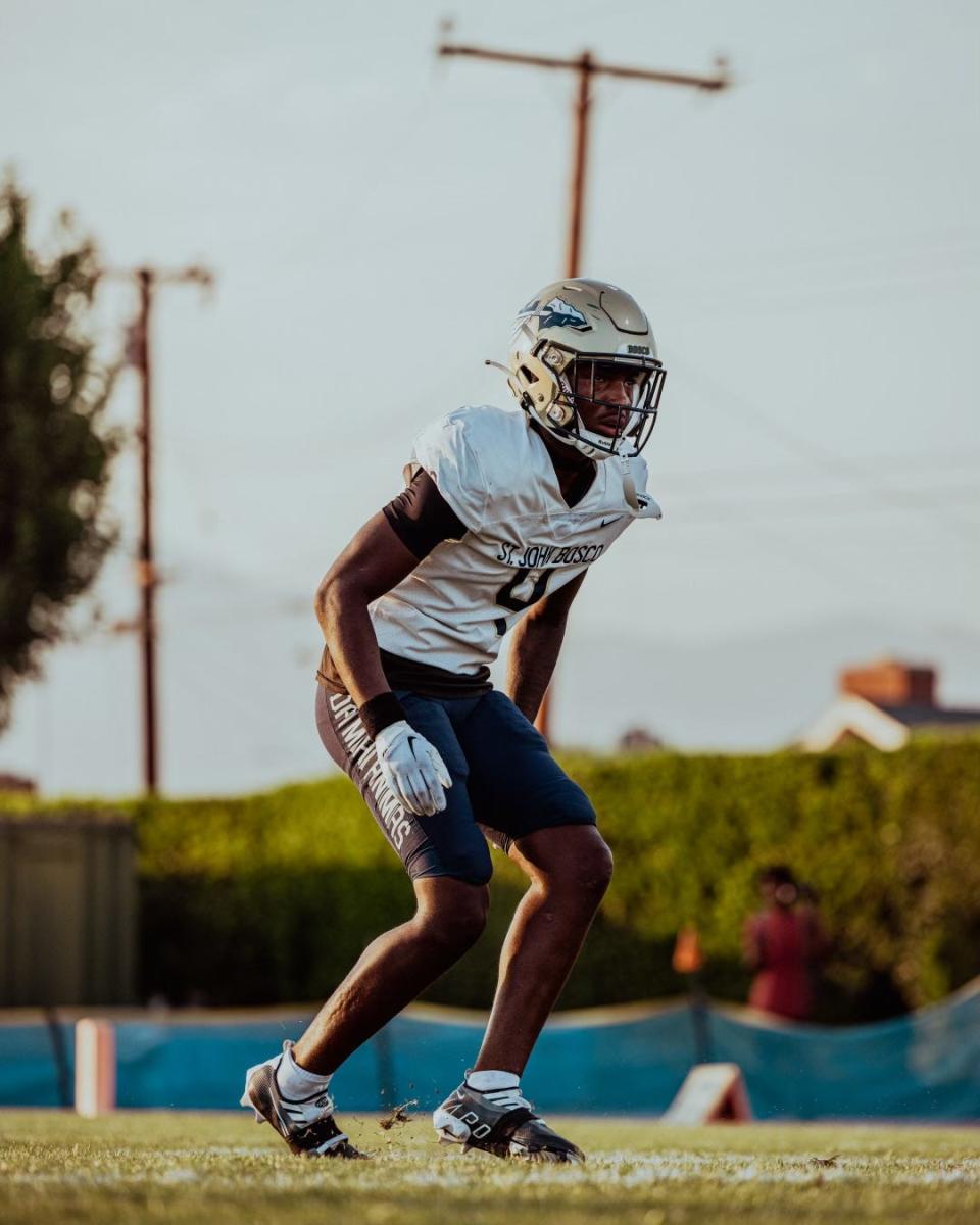 Aaron Williams stands on the field during a St. John Bosco High School football game. Williams signed with Louisville in January as a top-30 cornerback in the Class of 2023.