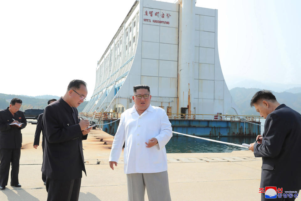 FILE - In this undated file photo provided on Wednesday, Oct. 23, 2019, by the North Korean government, North Korean leader Kim Jong Un, center, visits the Diamond Mountain resort in Kumgang, North Korea. North Korea on Friday, Nov. 15, 2019, said it issued an ultimatum to South Korea that it will tear down South Korean-made hotels and other facilities at the North’s Diamond Mountain resort if the South continues to ignore its demands to come and clear them out. Korean language watermark on image as provided by source reads "KCNA" which is the abbreviation for Korean Central News Agency. (Korean Central News Agency/Korea News Service via AP, File)