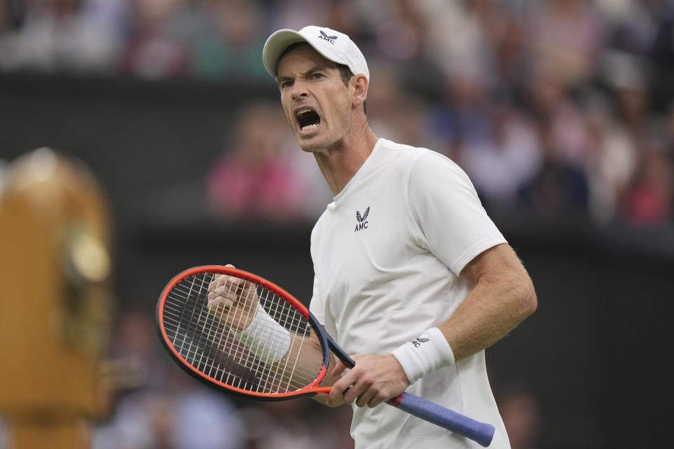 Britain's Andy Murray celebrates winning a point from Britain's Ryan Peniston during the first round men's singles match on day two of the Wimbledon tennis championships in London, Tuesday, July 4, 2023. (AP Photo/Alberto Pezzali)