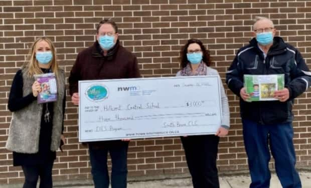 School officials pose with NWMO relationship manager Paul Austin, second from the left, at a cheque presentation at Hillcrest Central School in Teeswater. The NWMO has been bankrolling community projects for years through a 'goodwill' fund.