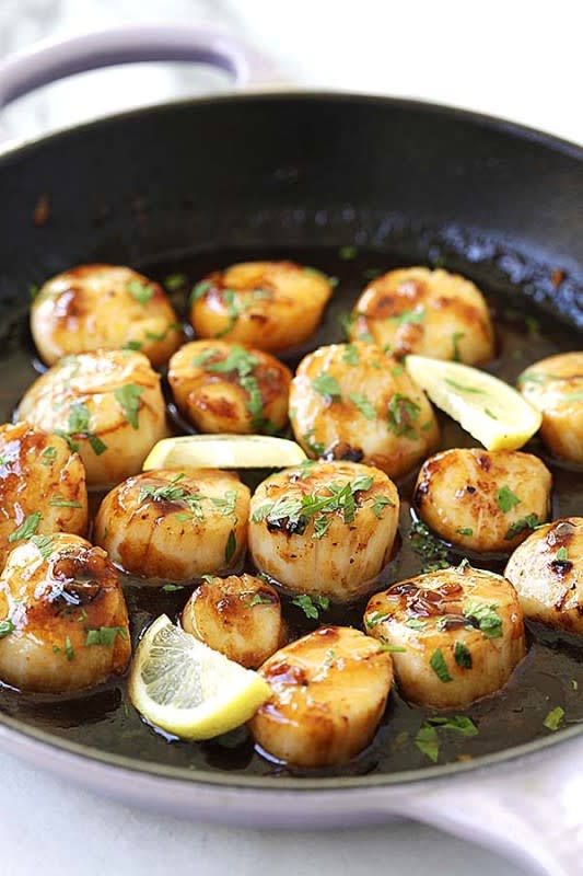 <p>Rasa Malaysia</p><p>Honey sriracha scallops—outrageously delicious scallops in sticky sweet, savory and mildly spicy honey Sriracha sauce. Every bite is bursting with fresh and juicy goodness.</p><p><strong>Get the recipe: <a href="https://rasamalaysia.com/honey-sriracha-scallops/" rel="nofollow noopener" target="_blank" data-ylk="slk:Honey Sriracha Scallops;elm:context_link;itc:0;sec:content-canvas" class="link rapid-noclick-resp">Honey Sriracha Scallops</a></strong></p>