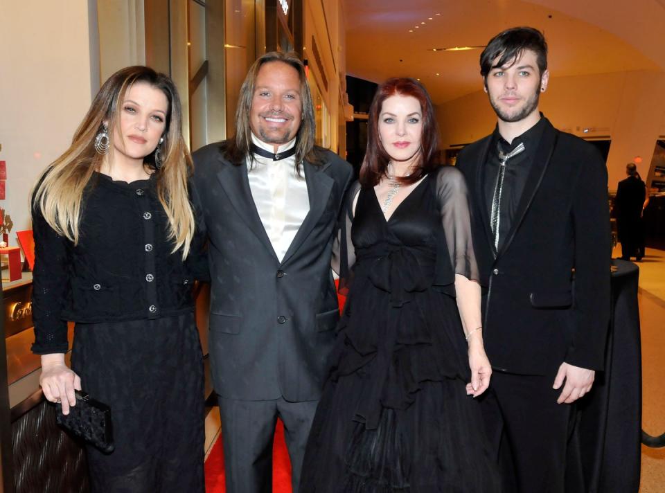 navarone garibaldi garcia posing for a photo with lisa marie presley, vince neil, and priscilla presley