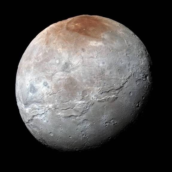 Pluto's largest moon, Charon, has a dull, gray surface marred by a bright-red spot at the poles. As the red material is deposited, radiation may slowly dull its color, changing it to gray like the rest of