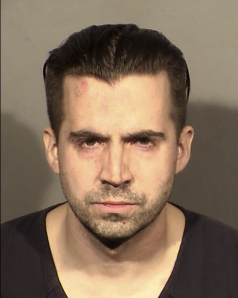 FILE - This booking photo provided by the Las Vegas Police Department shows Officer Caleb Rogers in Las Vegas, Feb. 27, 2022. A jury trial is set to begin Monday, July 10, 2023, in a federal case accusing the former Las Vegas police officer in three casino heists over a four-month span that netted more than $85,000. (Las Vegas Police Department via AP, File)