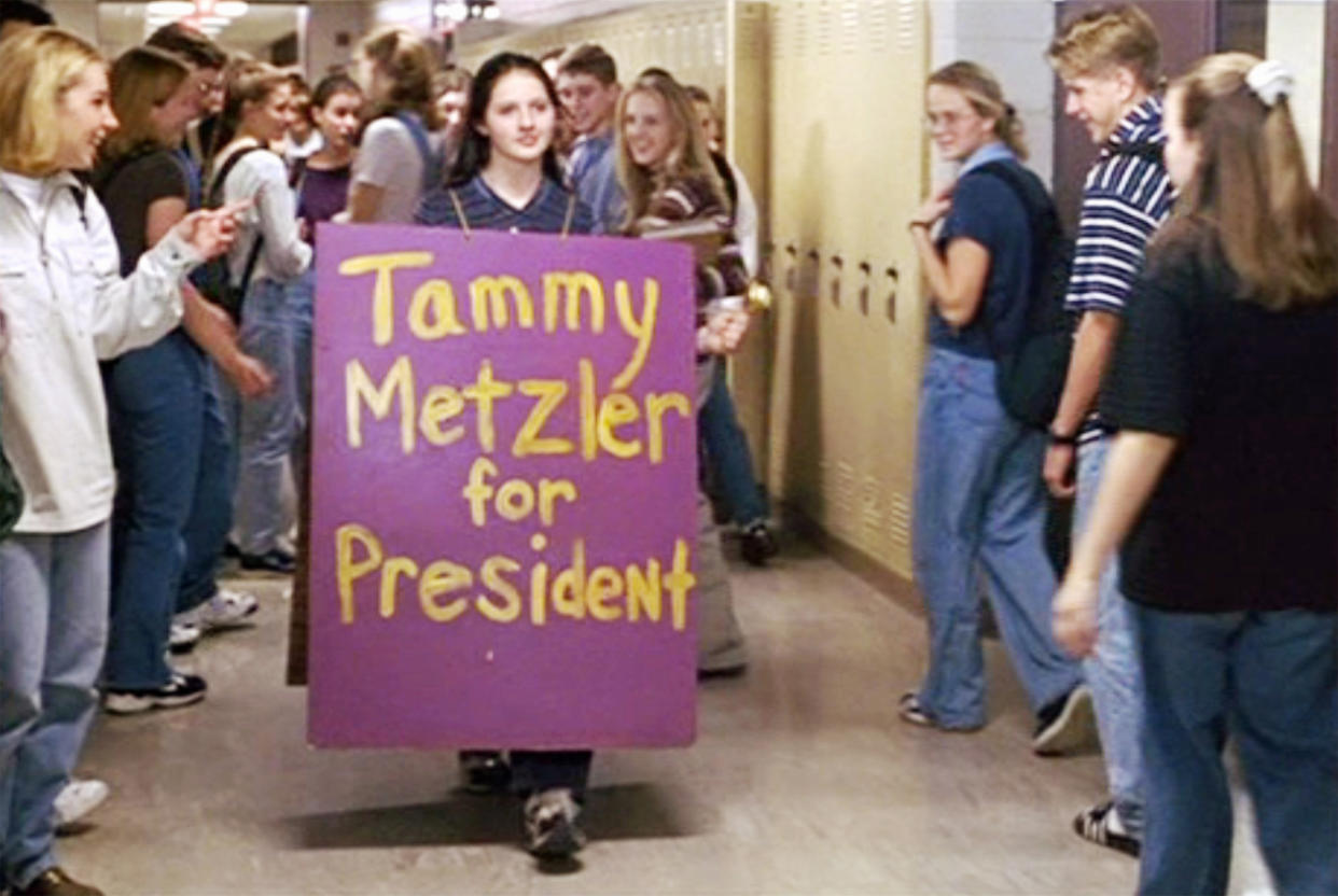 LOS ANGELES - APRIL 23: The movie "Election", directed by Alexander Payne. Seen here in center, Jessica Campbell (as Tammy Metzler). She wears a sandwich board featuring the slogan, 'Tammy Metzler for President'. Initial theatrical release, Friday, April 23, 1999. Image is a screen grab. (Photo by CBS via Getty Images)