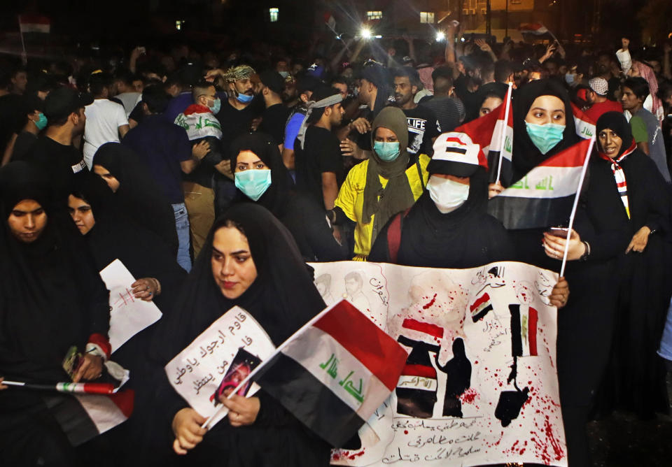 Anti-government protesters gather near Basra provincial council building during a demonstration in Basra, Iraq, Monday, Oct. 28, 2019. (AP Photo/Nabil al-Jurani)