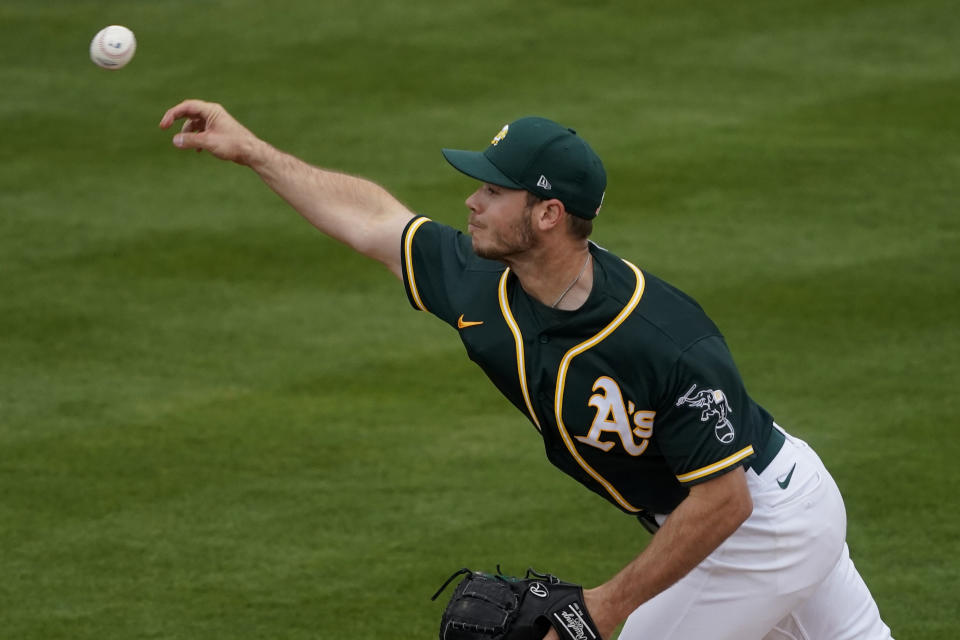 Oakland Athletics starting pitcher Daulton Jefferies throws against the Colorado Rockies during the second inning of a spring training baseball game, Tuesday, March 23, 2021, in Mesa, Ariz. (AP Photo/Matt York)
