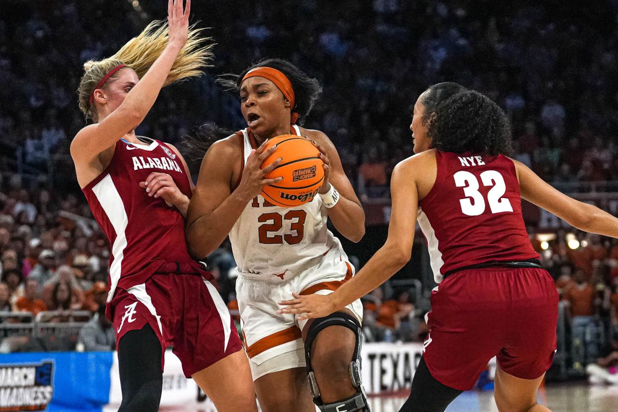 Texas forward Aaliyah Moore pushes past Alabama guards Sarah Barker and Aaliyah Nye during the Longhorns' second-round win of the NCAA Women's Tournament on Sunday. Texas plays Gonzaga in Friday night's Sweet 16 for a berth in the Elite Eight.