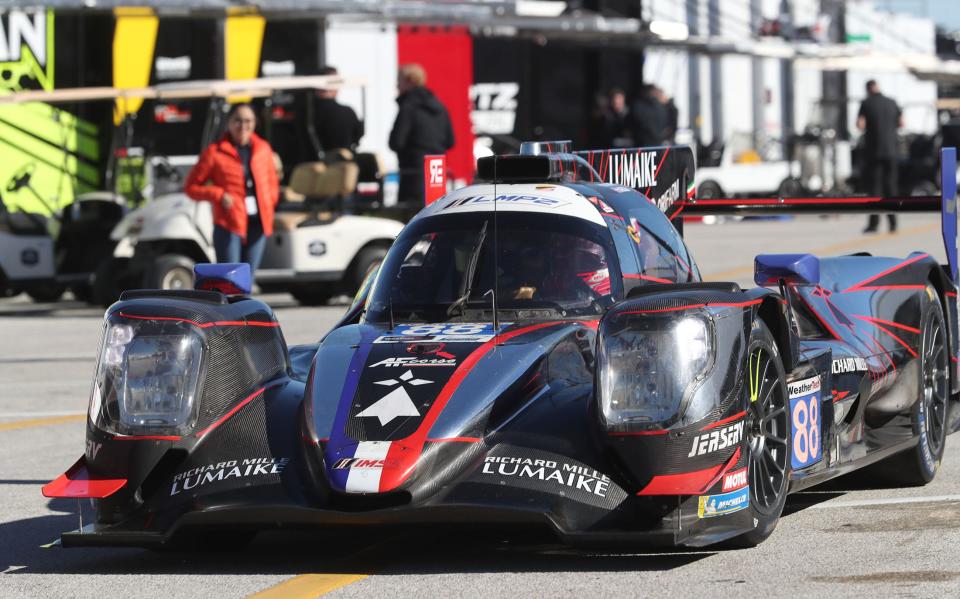 The No. 88 Oreca LMP2 07 rolls through the garage as it heads out on track, Wednesday December 6, 2023, as IMSA teams take to Daytona International Speedway for the first of four days of testing for the Rolex 24.