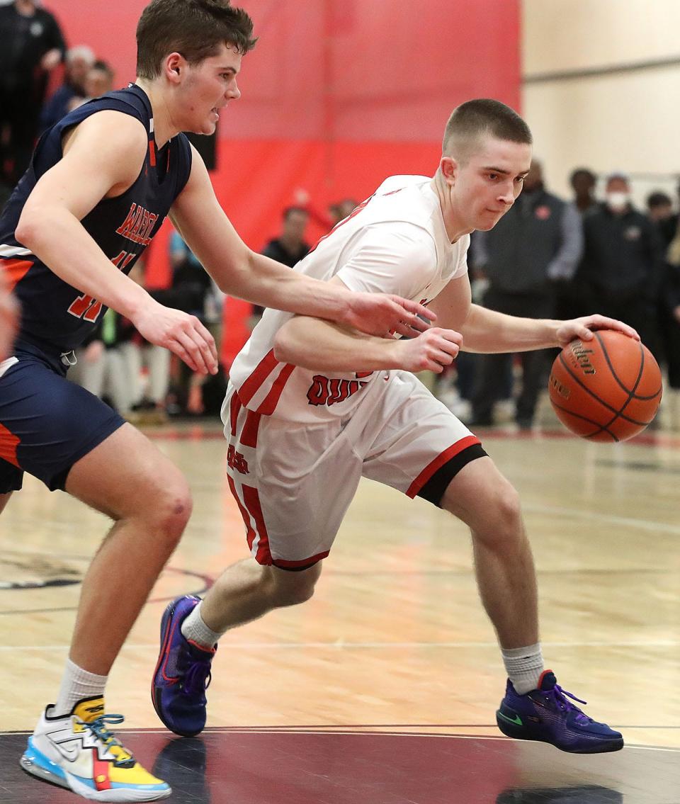 Raiders guard Zach Taylor moves toward the basket. The North Quincy High boys basketball team beat Walpole High in a close game in MIAA tournament action on Wednesday, March 9, 2022.
