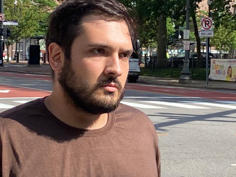 Alessio Dandrea, 27, of Johnston, leaves federal court in Providence on Friday after a prosecutor asked a magistrate to jail him, citing his attempt to arm himself with a converted, automatic AR-15 and asserting that other evidence raised the possibility that he might have been planning racial or antisemitic violence.
