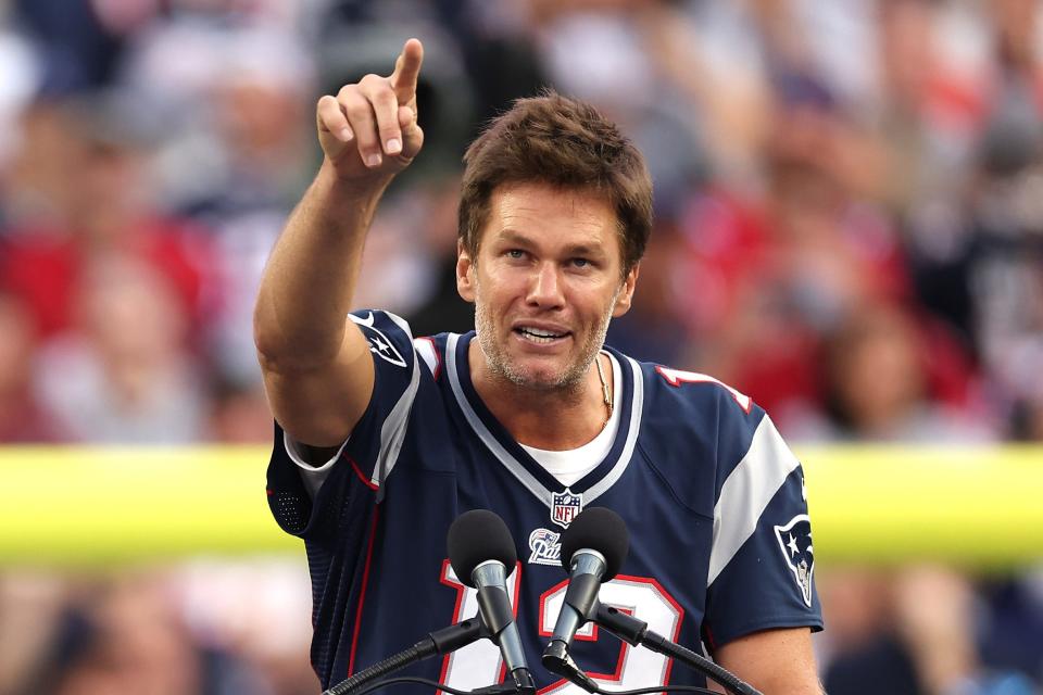 Former New England Patriots quarterback Tom Brady speaks during a ceremony honoring him at halftime of New England's game against the Philadelphia Eagles at Gillette Stadium on September 10, 2023 in Foxborough, Massachusetts.