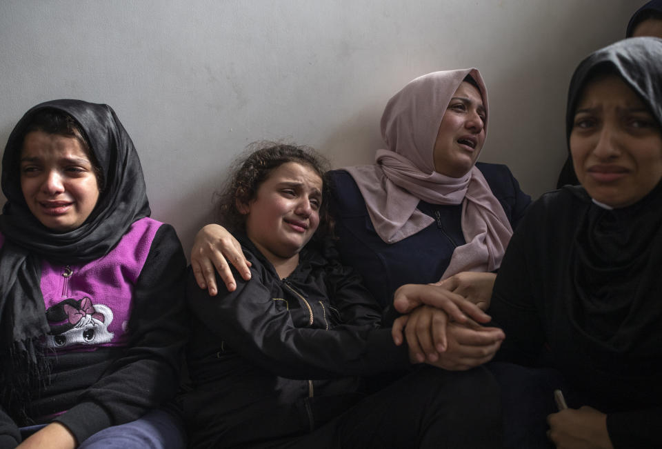 Relatives of Islamic Jihad commander, Bahaa Abu el-Atta, who was killed with his wife by an Israeli missile strike that hit their home, mourn during the funeral in Gaza City, Tuesday, Nov. 12, 2019. (AP Photo/Khalil Hamra)