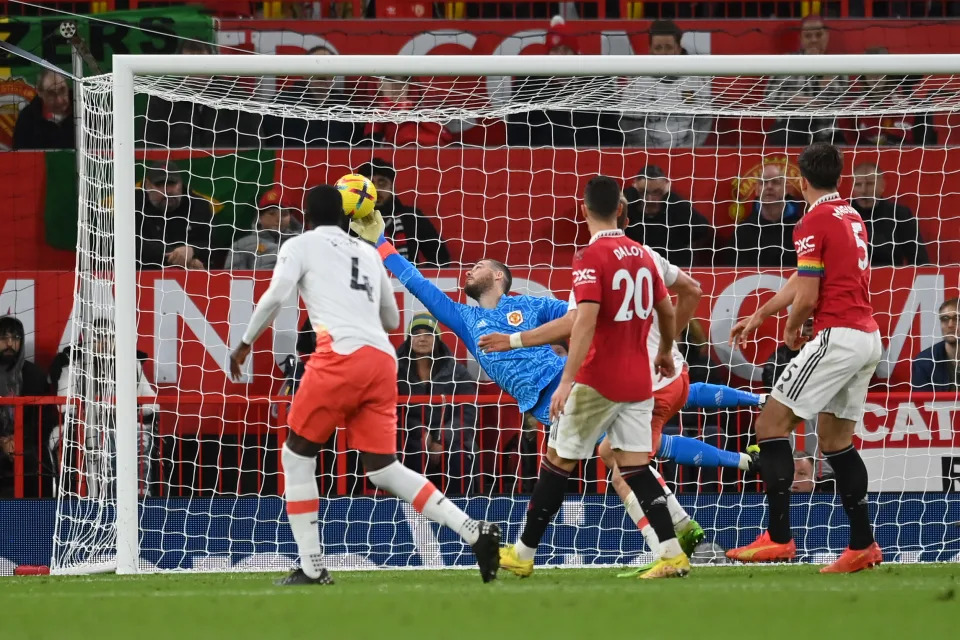 MANCHESTER, ENGLAND - OCTOBER 30: David De Gea of Manchester United makes a save from Kurt Zouma of West Ham United during the Premier League match between Manchester United and West Ham United at Old Trafford on October 30, 2022 in Manchester, England. (Photo by Michael Regan/Getty Images)