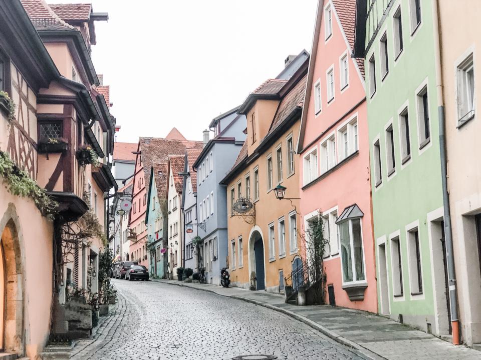 colorful houses along an empty road in germany