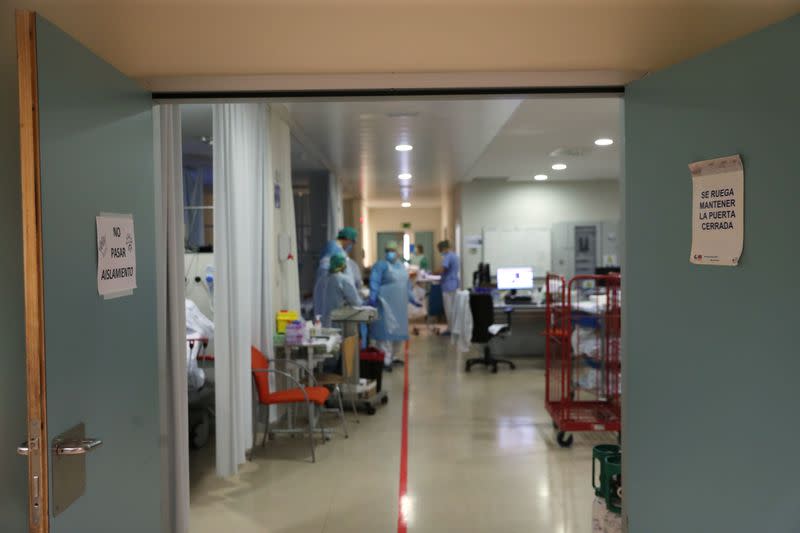 A sign that reads "Don't enter, isolation" and a red line on the floor that separates the "clean" and "dirty" areas to prevent infection are seen at the emergency room as the spread of the coronavirus disease (COVID-19) continues