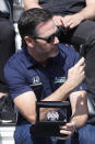 Jimmie Johnson takes a photo during the drivers meeting for the Indianapolis 500 auto race at Indianapolis Motor Speedway, Saturday, May 28, 2022, in Indianapolis. (AP Photo/Darron Cummings)