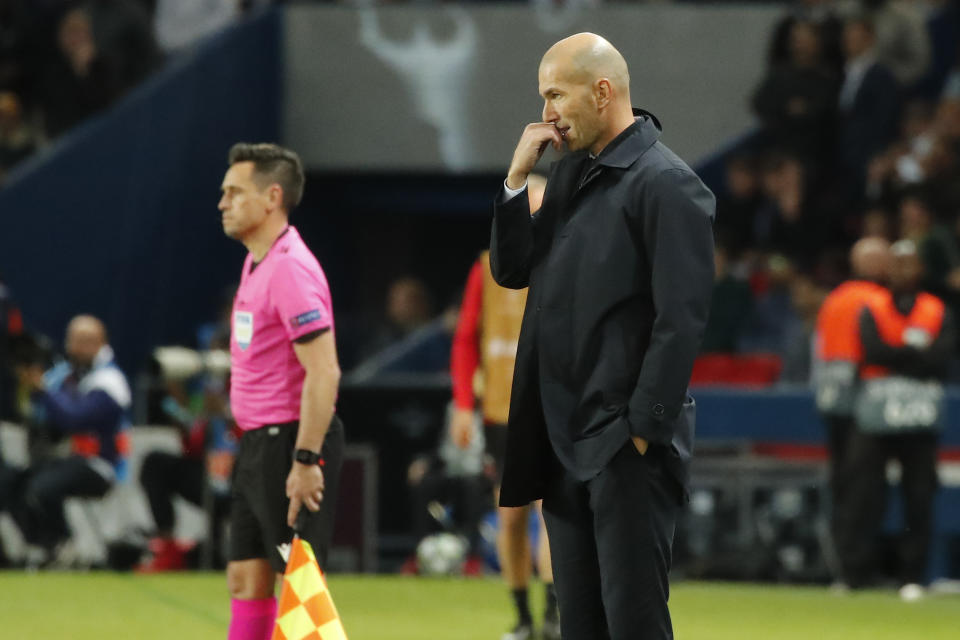 Real Madrid's head coach Zinedine Zidane reacts during the Champions League group A soccer match between PSG and Real Madrid at the Parc des Princes stadium in Paris, Wednesday, Sept. 18, 2019. (AP Photo/Francois Mori)