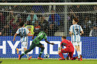 Nigeria's Rilwanu Haliru Sarki, center, celebrates scoring his side's 2nd goal against Argentina during a FIFA U-20 World Cup round of 16 soccer match at the Bicentenario stadium in San Juan, Argentina, Wednesday, May 31, 2023. (AP Photo/Natacha Pisarenko)