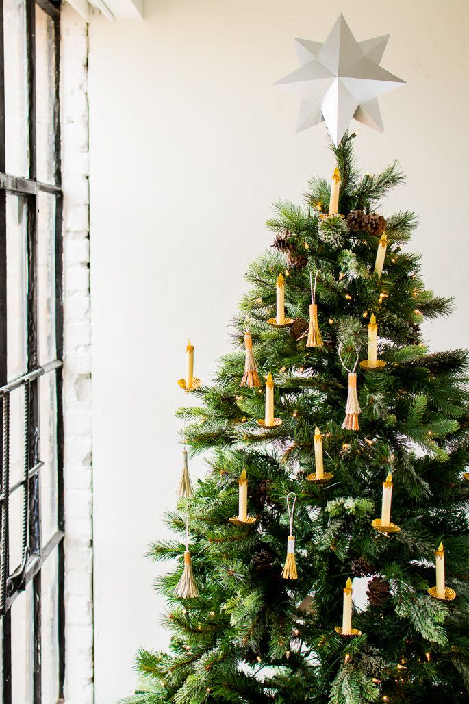 <p>Though this Christmas tree might look simple, the handcrafted gold candles and tassels feel romantic and nostalgic, all while embodying the magic that makes the holiday season feel so special.</p><p><strong>Get the tutorial at <a href="http://thehousethatlarsbuilt.com/2017/11/paper-candle-christmas-tree-ornament.html/" rel="nofollow noopener" target="_blank" data-ylk="slk:The House That Lars Built;elm:context_link;itc:0;sec:content-canvas" class="link ">The House That Lars Built</a>.</strong></p><p><a class="link " href="https://www.amazon.com/American-Crafts-4-Pack-Glitter-Everyday/dp/B008Q1GKHW/?tag=syn-yahoo-20&ascsubtag=%5Bartid%7C10050.g.1251%5Bsrc%7Cyahoo-us" rel="nofollow noopener" target="_blank" data-ylk="slk:SHOP GOLD CRAFTING GLITTER;elm:context_link;itc:0;sec:content-canvas">SHOP GOLD CRAFTING GLITTER</a></p>