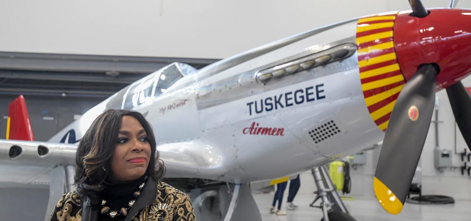 Congresswoman Terri Sewell stands beside a P-51, painted with Tuskegee Airmen markings, before the F-35A Lightning II Aircraft Arrival Ceremony at the 187th Fighter Wing at Dannelly Field in Montgomery, Ala., on Friday morning February 9, 2024.