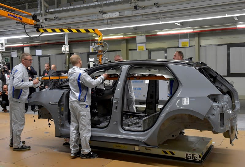 Employees work at a production line of a a new electric Volkswagen model ID.3 in Zwickau