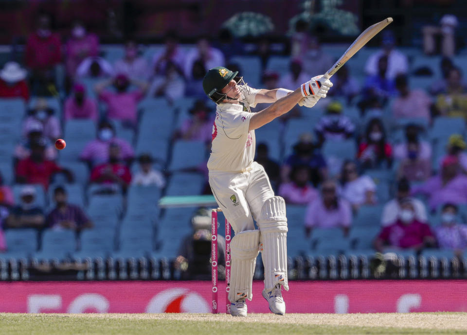 Australia's Steve Smith swings and misses the ball during play on day three of the third cricket test between India and Australia at the Sydney Cricket Ground, Sydney, Australia, Saturday, Jan. 9, 2021. (AP Photo/Rick Rycroft)