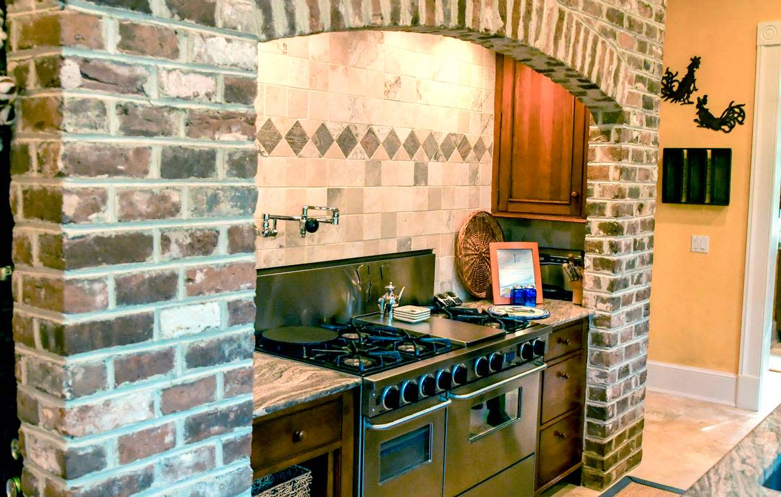 Recycled from the previous home, Savannah gray brick is one of the focal points in the kitchen at 32 W. Beach Lagoon Rd as pictured here on Dec. 2, 2022 on Hilton Head Island.