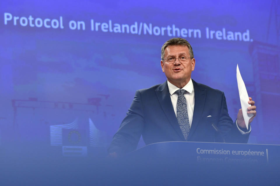 European Commissioner for Inter-institutional Relations and Foresight Maros Sefcovic holds up documents as he speaks during a media conference at EU headquarters in Brussels, Wednesday, June 15, 2022. Britain's government on Monday proposed new legislation that would unilaterally rewrite post-Brexit trade rules for Northern Ireland, despite opposition from some U.K. lawmakers and EU officials who say the move violates international law. (AP Photo/Geert Vanden Wijngaert)