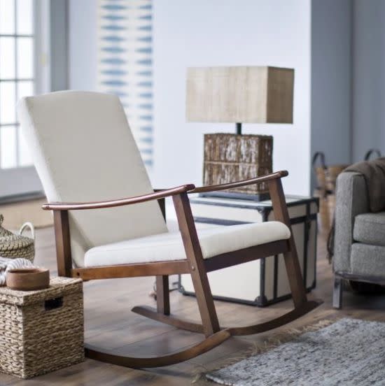 This rocking chair has a durable solid birch wood frame and curved armrests for added comfort and support. Get it at <a href="https://www.hayneedle.com/product/holdenmodernrockingchairupholsteredivory.cfm" target="_blank">Hayneedle</a>.